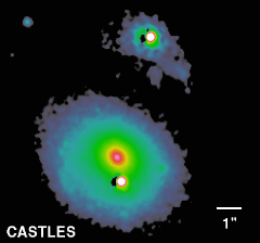 Double quasar Q0957+561, seen here as two bright white disks